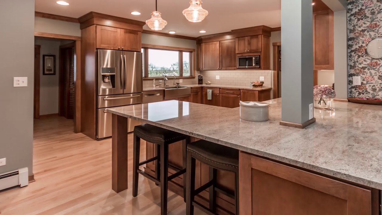 Modern renovated kitchen with white cabinetry and quartz countertops in Tomball, TX
